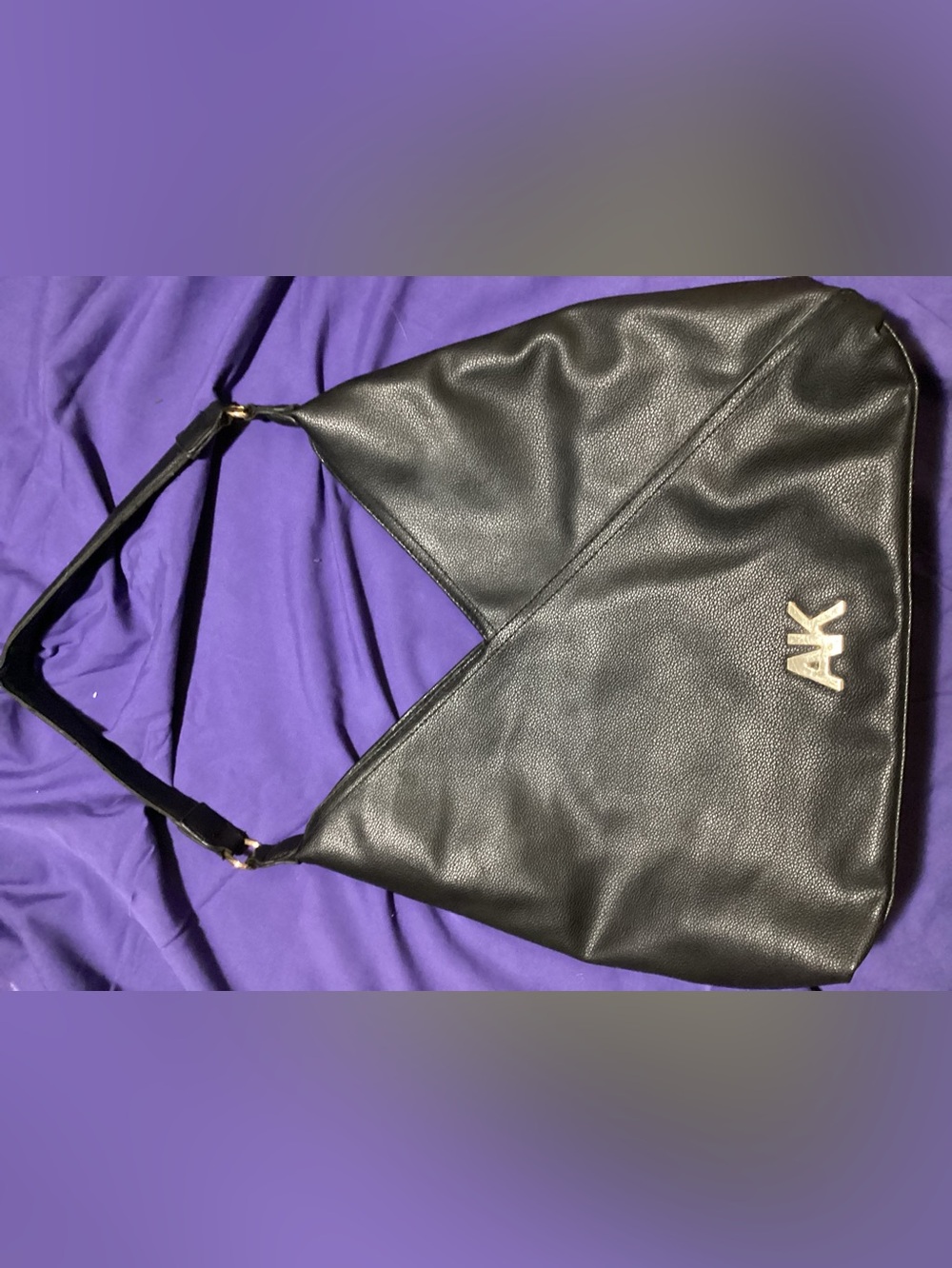 Black AK Embossed Leather Hobo Bag
